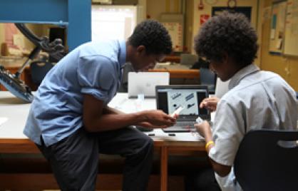Boys working on computer