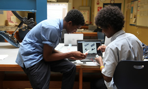 Boys working on computer
